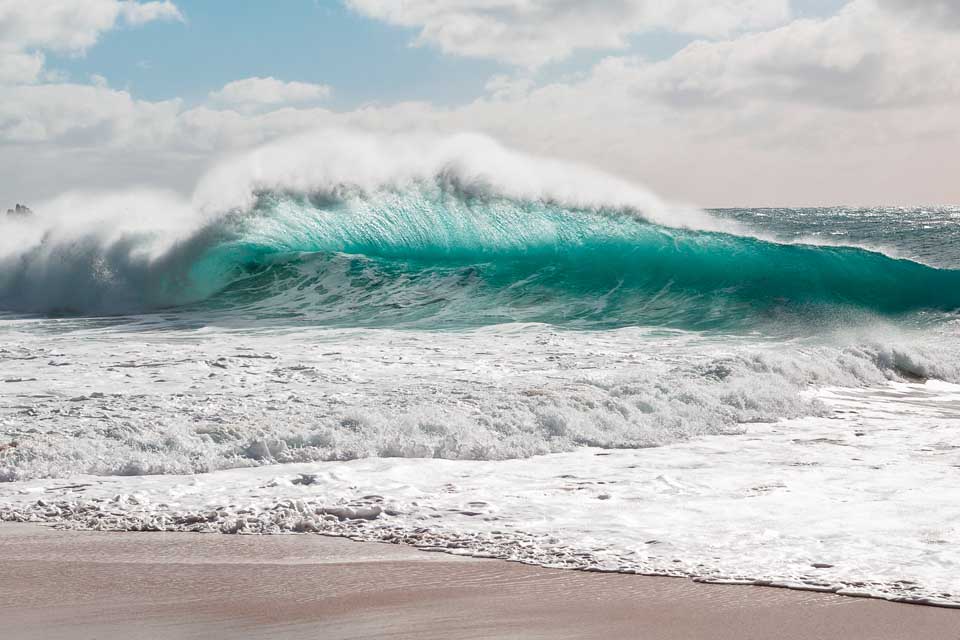 Waves at Porthcurno by Scott fisher